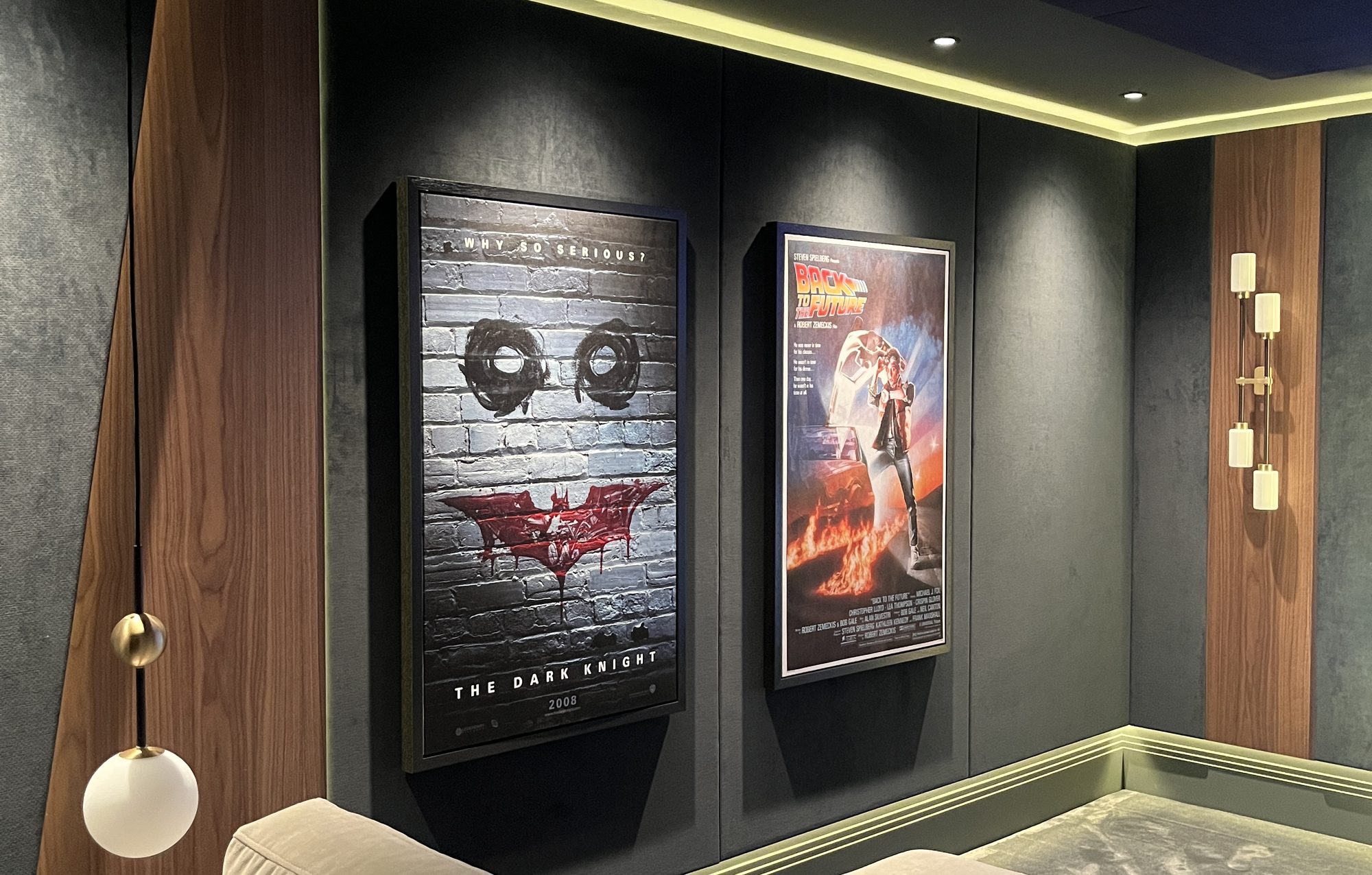 Modular seating below the framed wall panels with cove lighting