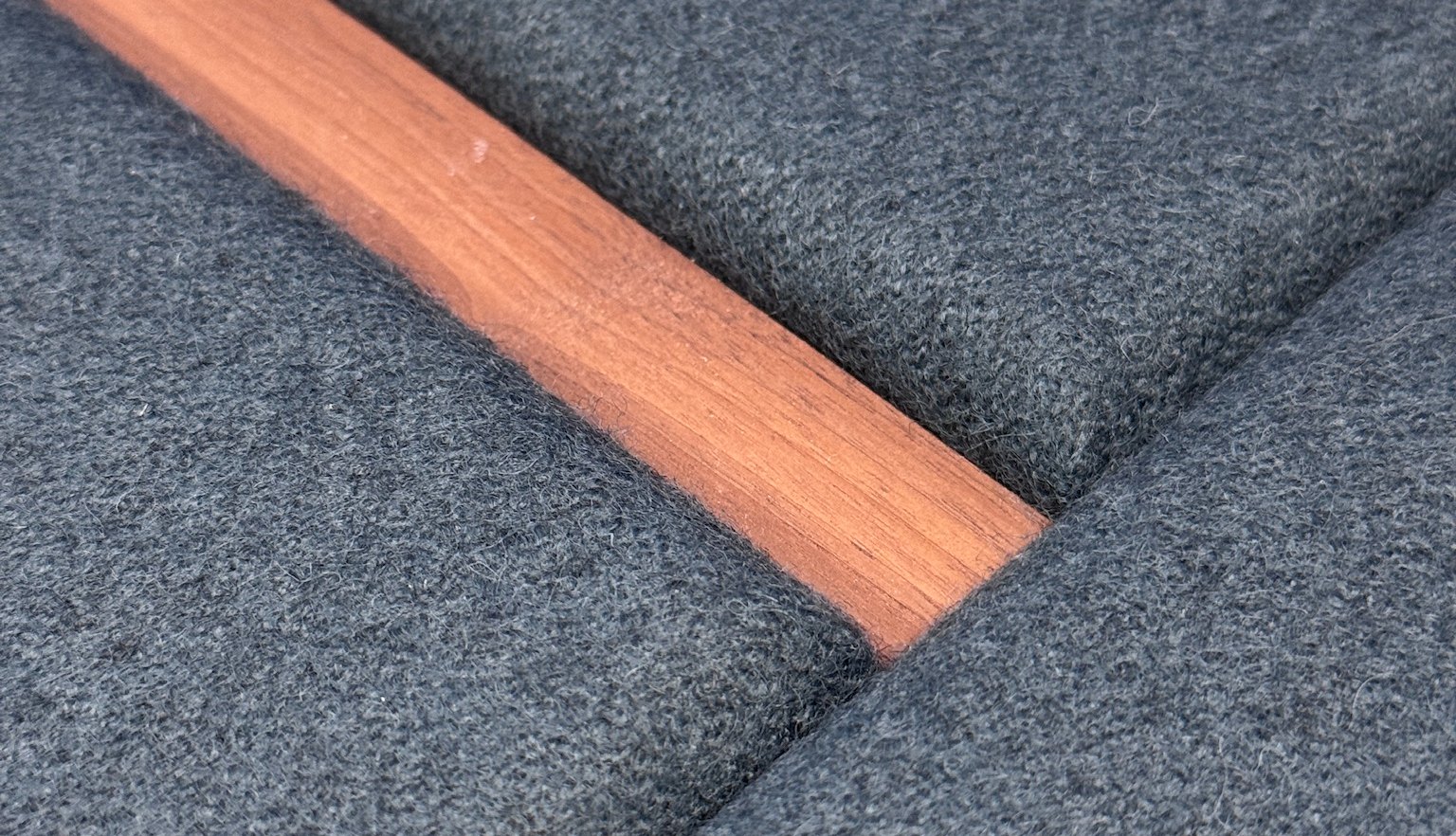 Handcrafted acoustic panelling with a timber reveal detail