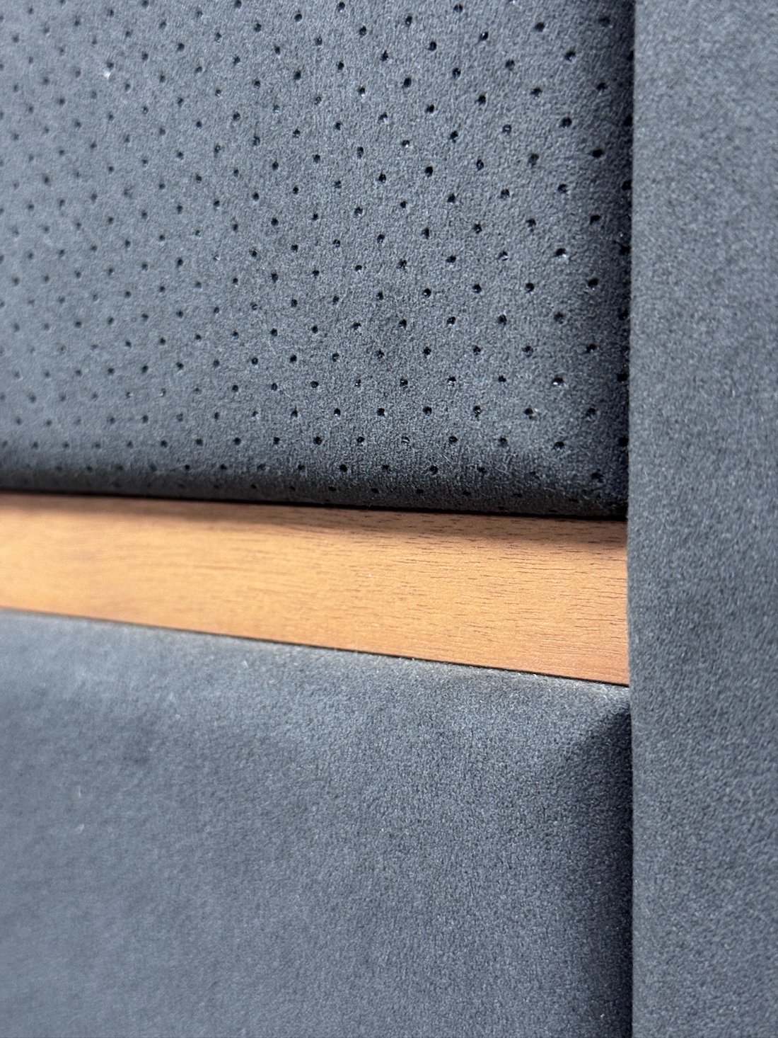 Handcrafted acoustic panel with micro-perforation and timber reveal