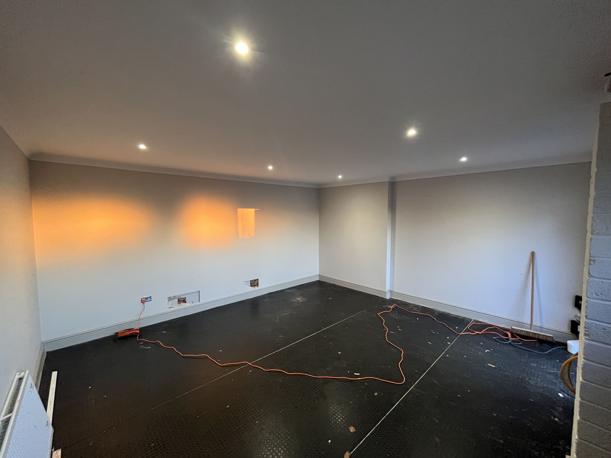The bare garage shell stripped back before the fit-out
